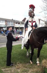 St.George hands the Flag of England to the leader of the Colour Party